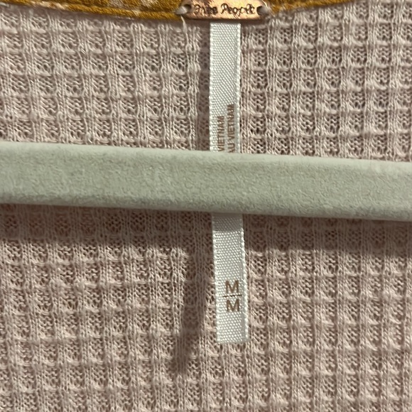 This is a beautiful Free People top with floral detail on the sleeves. - Picture 2 of 3